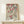 May include: Japanese woodblock print style artwork in light wood frame on white wooden dresser. Features pink cherry blossoms, small birds including green and brown swallow, with Japanese text. White gift box sits in front of frame. Print shows delicate floral branches against cream background in traditional ukiyo-e art style.