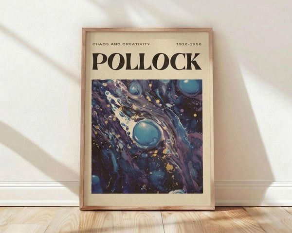 May include: Framed art poster displaying an abstract composition with swirling blue, purple, and navy tones interspersed with white paint splatters and golden yellow dots. The artwork features flowing, cosmic-like patterns reminiscent of galaxies or nebulae. Text reads "CHAOS AND CREATIVITY" and "POLLOCK" with dates "1912-1956" on cream-colored background. Natural wood frame sits against white wall on light wooden floor with soft window light creating diagonal shadows.