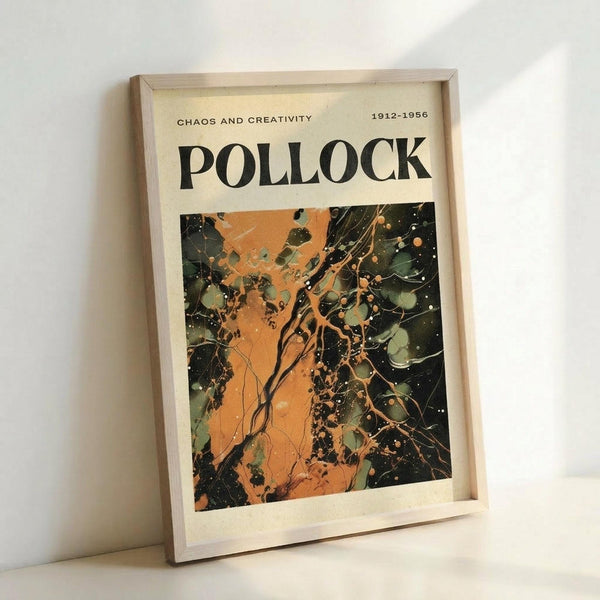 May include: Framed art print leaning against white wall showing abstract expressionist painting with chaotic splatters and drips in orange, green, and black colors. Text reads "CHAOS AND CREATIVITY" and "POLLOCK" with dates "1912-1956" at top. Light wooden frame surrounds cream-colored poster featuring dynamic paint drip patterns characteristic of action painting style.