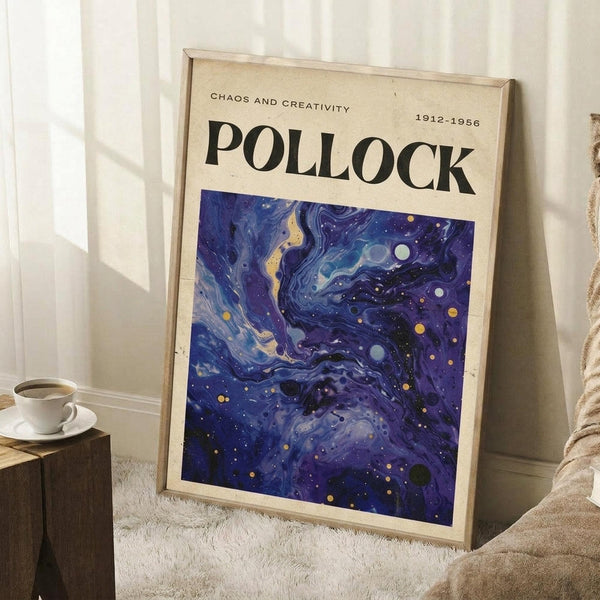 May include: Framed art print with cream background featuring "POLLOCK" text and "CHAOS AND CREATIVITY 1912-1956" above swirling blue and purple abstract design with golden dots, leaning against white wall corner next to coffee cup on wooden block and beige textured fabric on white rug