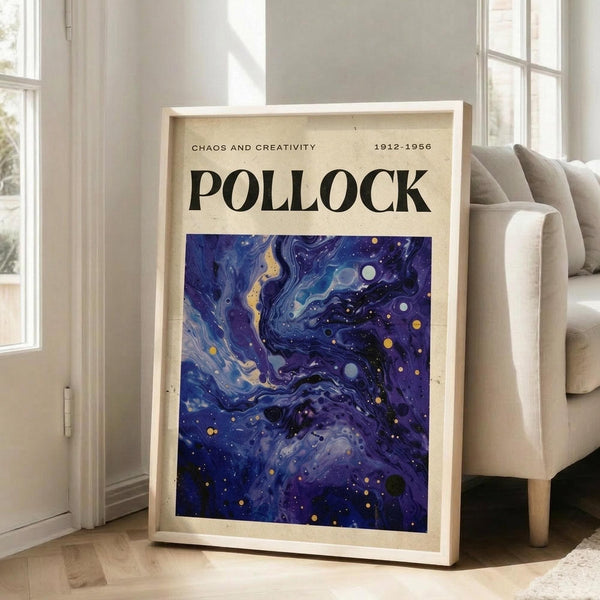 May include: Framed art poster with cream background featuring "POLLOCK" in bold black letters, "CHAOS AND CREATIVITY 1912-1956" text, and swirling blue abstract artwork with yellow and white dots. Natural wood frame leans against white wall next to beige upholstered chair in bright room with large windows and wooden floors.