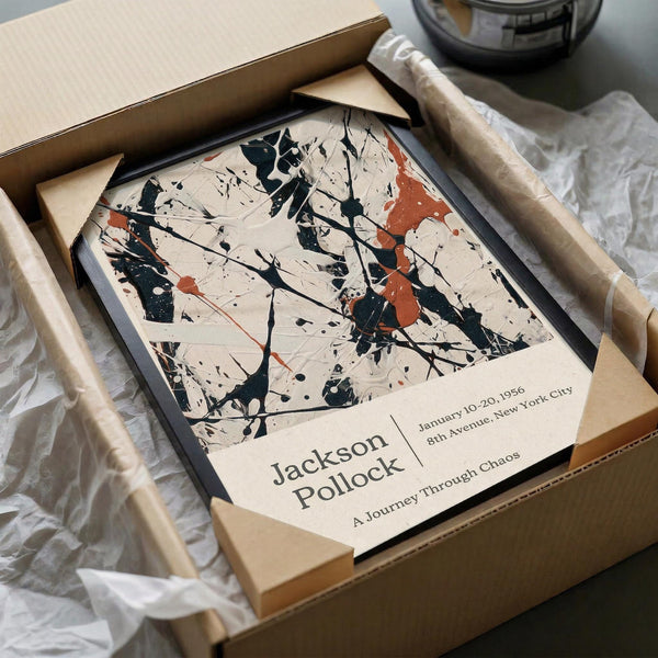 a framed print of Jackson Pollock's artwork titled "A Journey Through Chaos" displayed in a cardboard box.