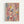 Framed abstract expressionist artwork featuring energetic paint splatters and drips in pink, blue, yellow, red, and cream colors across a light background. Black linear marks and gestural brushstrokes create dynamic movement throughout the composition. The piece is displayed in a natural wood frame against a white wall, showcasing the spontaneous, action-painting style with layered paint textures and scattered dots of various sizes.