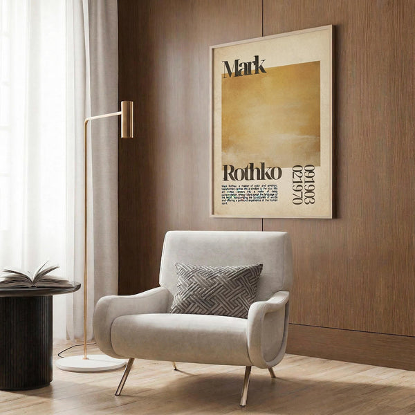 a modern living room with a white armchair, a floor lamp, and a framed poster on the wall.