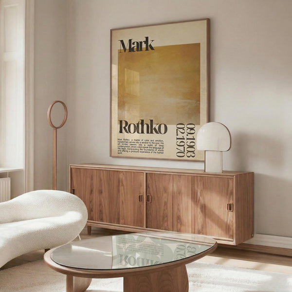 a modern living room with a large wooden cabinet, a white sofa, and a glass coffee table. A framed poster with text hangs on the wall above the cabinet.