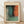May include: Framed abstract art print in light wood frame leaning against white wall on wooden floor. The artwork features soft, blended color fields in teal, orange, green and gray with organic, flowing boundaries. French text above reads "L'abstraction émotionnelle à la manière de" followed by "MARK ROTHKO" in large letters. Natural lighting creates subtle shadows on textured white fabric backdrop.