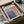a framed poster or artwork titled "Mark Rothko" displayed in a cardboard box.