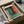 a framed abstract painting, which appears to be a work by the artist Mark Rothko, displayed in a cardboard box.