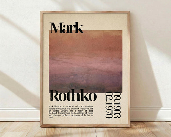 May include: Framed art poster featuring Mark Rothko's name in large black text above a horizontal color-blocked painting with warm orange, pink, and deep burgundy tones. Below shows "Rothko" and dates "1903-1970" in black typography with descriptive text about the artist. Light wood frame against cream background, displayed on wooden floor with soft natural lighting and shadows.