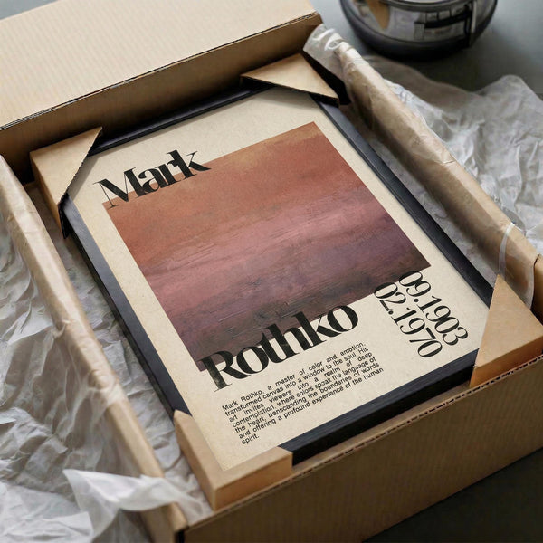 a framed poster or artwork with the name "Mark Rothko" and a date "09/02/1970" printed on it, placed in a cardboard box.