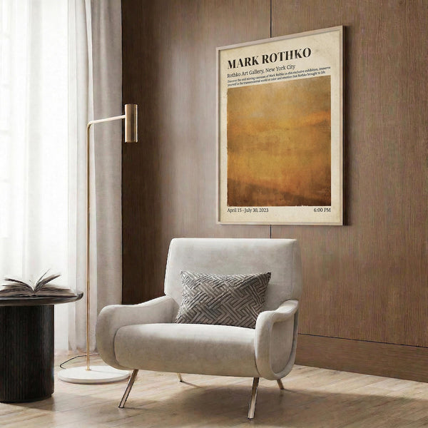 a modern living room with a white armchair, a floor lamp, and a framed poster on the wall.