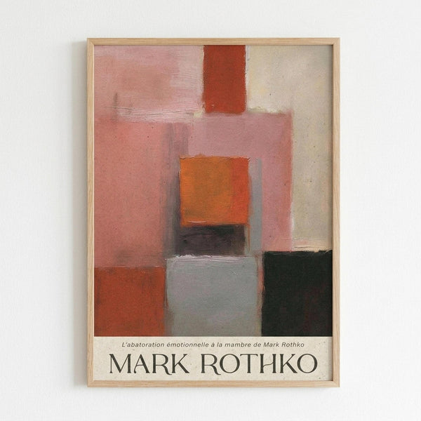 Framed abstract art print featuring geometric rectangular blocks in soft pink, orange, red, gray, and black tones with painterly brushstrokes. The composition shows layered translucent color fields in Rothko's signature style. Text at bottom reads "L'abatoration émotionnelle à la mambre de Mark Rothko" and "MARK ROTHKO" in large letters. Light wooden frame against white wall.