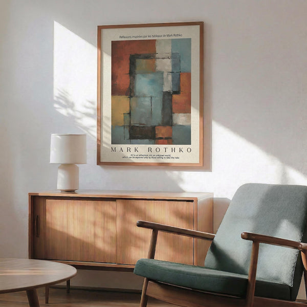 a living room with a wooden cabinet, a green armchair, and a wooden coffee table. Above the cabinet, there is a framed abstract painting hanging on the wall.