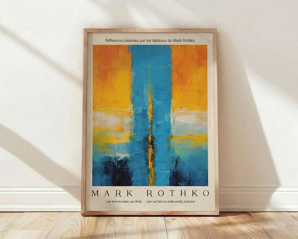 May include: Framed abstract art print leaning against white wall on light wood floor. Poster features vertical blue brushstrokes down center with warm orange and yellow sections above, transitioning to teal and darker blue below. French text at top, artist name and quote at bottom. Natural light creates soft shadows across the scene.
