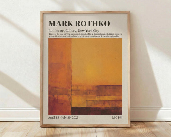 May include: Framed exhibition poster featuring Mark Rothko artwork with warm orange, yellow, and brown geometric color blocks. Light wood frame displays gallery information and exhibition dates. Poster leans against white wall on light wooden floor with soft natural lighting and fabric shadows.