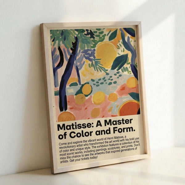 May include: Framed poster print featuring vibrant tropical landscape artwork with dark tree trunks, lush green foliage, golden sun, orange circular fruits scattered on coral-pink ground. Bold colors in painterly style with exhibition text below. Natural wood frame leaning against white wall in bright interior setting.
