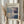 May include: Person in cream sweater holding framed abstract art poster featuring soft rectangular color blocks in blues, purples, and neutrals, with dried wheat stems beside window with natural lighting