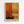 May include: Framed abstract art print hanging on white wall featuring warm orange, yellow, and cream rectangular color blocks with rough, textured brushwork and dark linear elements creating a grid-like composition, displayed in light wooden frame