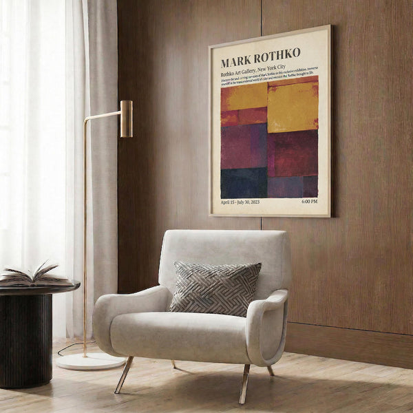 a modern living room with a white armchair, a floor lamp, and a framed poster of Mark Rothko's artwork hanging on the wall.