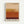 Abstract color field artwork with horizontal bands transitioning from cream at top through golden yellow, orange, burnt orange, to deep burgundy at bottom, displayed in light wood frame against white wall