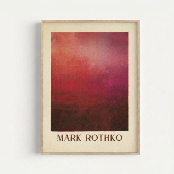 May include: Framed art print featuring an abstract color field painting with gradient transitions from bright coral and pink tones in the upper portion to deep burgundy and dark brown in the lower section. The artwork displays soft, blended rectangular color blocks in Rothko's signature style. Presented in a light wood frame with cream matting against a white wall, with the artist's name printed below the image.