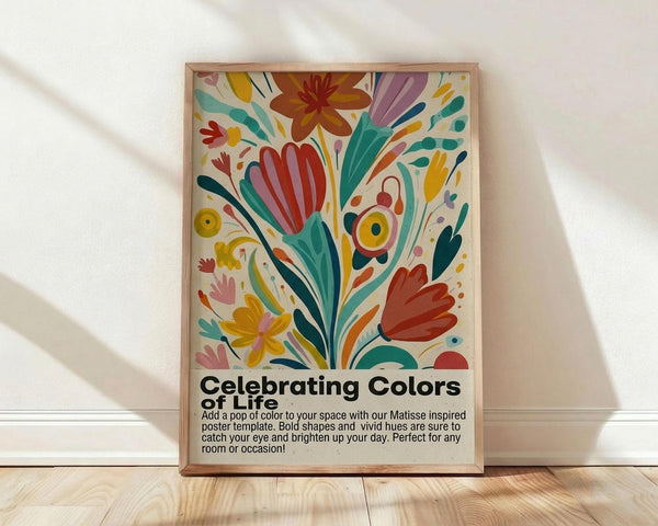 May include: Framed poster with colorful abstract floral design in Matisse-inspired style, featuring vibrant red, yellow, teal, and purple botanical shapes on cream background. Black text below reads "Celebrating Colors" with descriptive paragraph. Natural wood frame sits on light wooden floor against white wall with soft shadows.