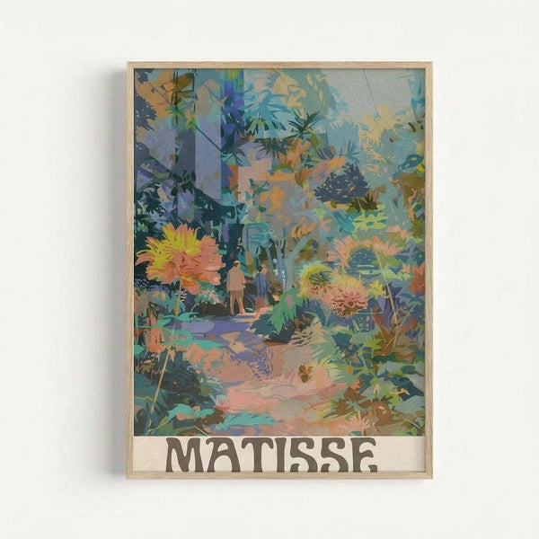 May include: Framed art print displayed on white wall featuring vibrant tropical garden scene with overlapping translucent layers in blues, greens, oranges, and corals. Abstract botanical elements include palm fronds, flowering plants, and small human figures on a winding path. Artist name "MATISSE" appears in bold letters at bottom. Natural wood frame surrounds the colorful layered composition with dreamy, collage-like aesthetic.