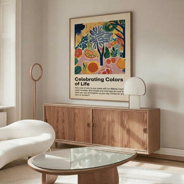 May include: Colorful abstract botanical poster with tropical leaves, fruits and plants in vibrant blues, oranges, greens and pinks, displayed in thin wooden frame above mid-century walnut credenza. Modern living room setting features white curved chair, glass oval coffee table, and natural lighting creating warm shadows on neutral walls.
