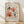 May include: Framed vintage-style botanical art print featuring abstract coral pink and rust orange flowers with black stems and circles on cream background, displayed in light wood frame against white wall on wooden floor with natural lighting shadows