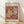May include: Framed art print in light wood frame leaning against white wall on wooden floor. Poster features abstract cut-out shapes in warm tones of orange, burgundy, yellow and cream with crosshatch patterns and organic coral-like forms. Text reads "MATISSE" at top and "PAPIERS DÉCOUPÉS" at bottom on cream background. Soft natural lighting creates diagonal shadows across the scene.