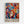 May include: Colorful abstract art poster in light wood frame hanging on white wall. Vibrant artwork features stylized faces and masks surrounded by flowing organic shapes in blues, reds, oranges, yellows and greens. Bold "MATISSE" text appears at bottom in black letters. Modern artistic style with decorative foliage elements and geometric patterns throughout the composition.
