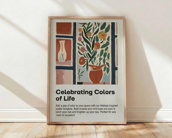 May include: Framed poster with Matisse-inspired still life artwork featuring terracotta vases with green foliage and colorful flowers in geometric panels. The print shows warm earth tones of rust, coral, and sage green with bold simplified shapes. Natural wood frame sits on light wooden floor against white textured wall with soft shadows. Black text below reads "Celebrating Colors of Life" with descriptive paragraph.