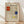 May include: Framed poster print featuring Piet Mondrian's geometric grid composition with red rectangles in upper left, blue square on right side, and yellow rectangle at bottom, all connected by black sketched lines on cream background. Light wood frame leaning against white wall on natural wood floor with soft shadows from window light.