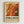 May include: Framed abstract art poster with swirling orange, yellow, and red paint splatters in Jackson Pollock's drip painting style, displayed in light wood frame against white wall. Text reads "AN EXHIBITION BY ABSTRACT VISIONARY" at top, "POLLOCK" in large black letters, "EMBRACE THE CHAOTIC REALM OF CREATIVITY" and exhibition dates below the vibrant abstract artwork.