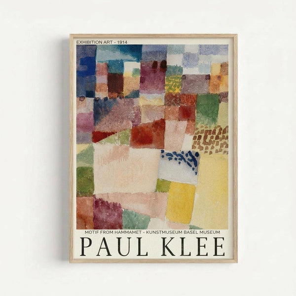 A framed exhibition poster featuring Paul Klee's abstract watercolor artwork from 1914. The composition shows overlapping geometric shapes in muted colors including blues, greens, yellows, reds, and purples, with some areas containing dotted patterns. The artwork has a mosaic-like quality with translucent washes of color. Text at the top reads "EXHIBITION ART - 1914" and bottom text indicates "MOTIF FROM HAMMAMET - KUNSTMUSEUM BASEL MUSEUM" with "PAUL KLEE" prominently disp