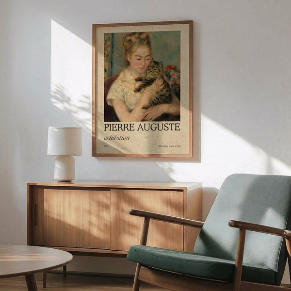 May include: Framed poster displaying a soft-toned impressionist painting of a blonde woman in white dress holding a striped tabby cat, hung above a wooden sideboard with white ceramic lamp in a modern living room with mint green armchair and natural lighting casting shadows on white walls.