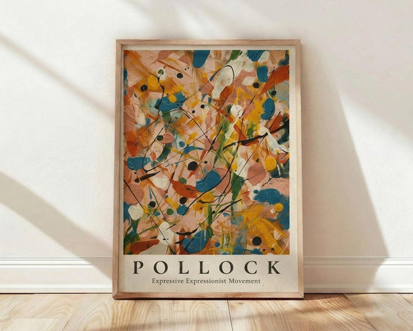 May include: Abstract expressionist art poster in light wooden frame leaning against white wall on natural wood floor. Vibrant painting features energetic drips, splatters and brushstrokes in orange, blue, yellow, green and black paint with dynamic flowing lines throughout. Text below artwork reads "POLLOCK Expressive Expressionist Movement" in clean black typography. Soft natural lighting creates gentle shadows on textured white wall.