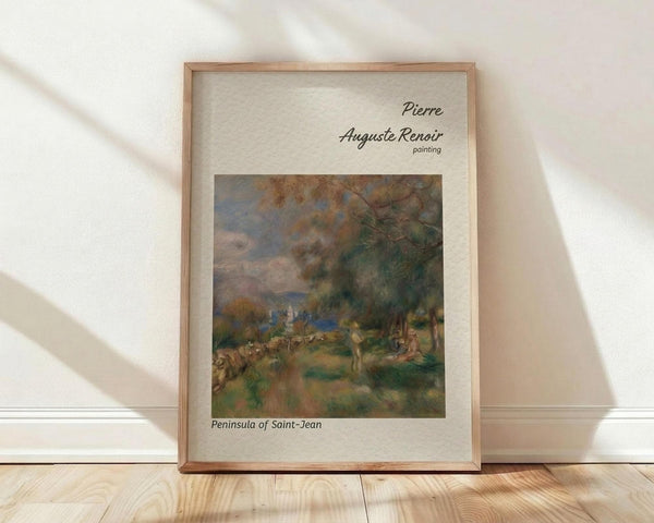 May include: Framed art print featuring an Impressionist landscape painting with soft brushstrokes in earth tones of green, brown, and blue, showing trees and figures in a pastoral scene. The print is displayed in a light wood frame with cream matting, leaning against a white wall on light wooden flooring with natural window light creating diagonal shadows across the scene.