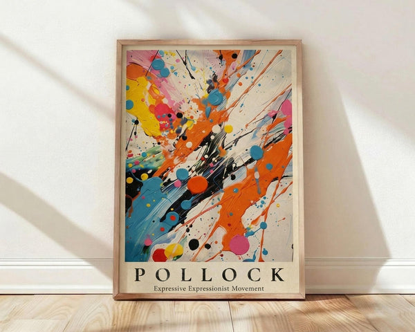 May include: Framed abstract art print in wooden frame leaning against white wall on light wood floor. Artwork features energetic paint splatters, drips and brushstrokes in vibrant orange, blue, yellow, pink and black against cream background. Text below reads "POLLOCK Expressive Expressionist Movement" in bold letters. Natural lighting creates soft shadows on textured white wall.