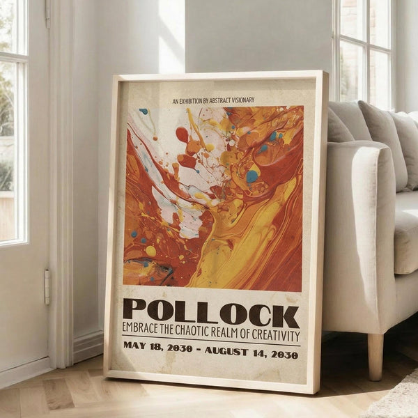 May include: Framed abstract art exhibition poster leaning against white wall next to beige sofa. Features vibrant orange, yellow, and red paint swirls with scattered colorful dots on cream background. Bold black text reads "POLLOCK" and "EMBRACE THE CHAOTIC REALM OF CREATIVITY" with exhibition dates. Natural lighting from tall windows creates soft shadows on hardwood floor.