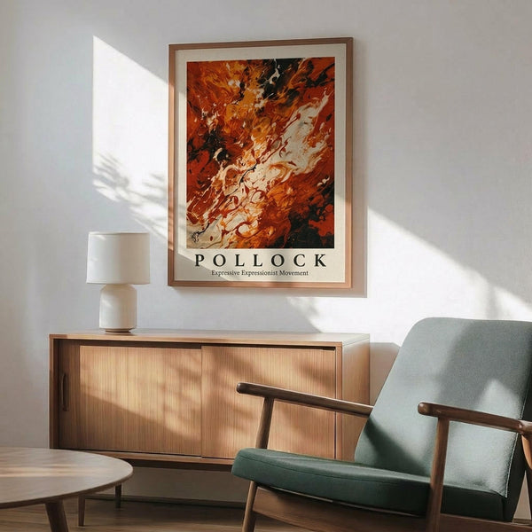 May include: Abstract expressionist art poster with vibrant orange, red, and black paint swirls in wooden frame, displayed above mid-century modern wooden credenza with white ceramic lamp. Sage green upholstered chair with wooden arms sits nearby on hardwood floor. Soft natural light creates shadows on white wall in minimalist living room setting.