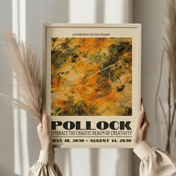 May include: Person in beige clothing holding framed exhibition poster featuring abstract artwork in warm autumn colors of orange, yellow, and green with flowing organic shapes. Light wooden frame against neutral background with dried pampas grass visible to the left. Poster displays "POLLOCK" in bold black letters with exhibition dates "MAY 18, 2030 - AUGUST 14, 2030" and subtitle about embracing chaotic creativity.