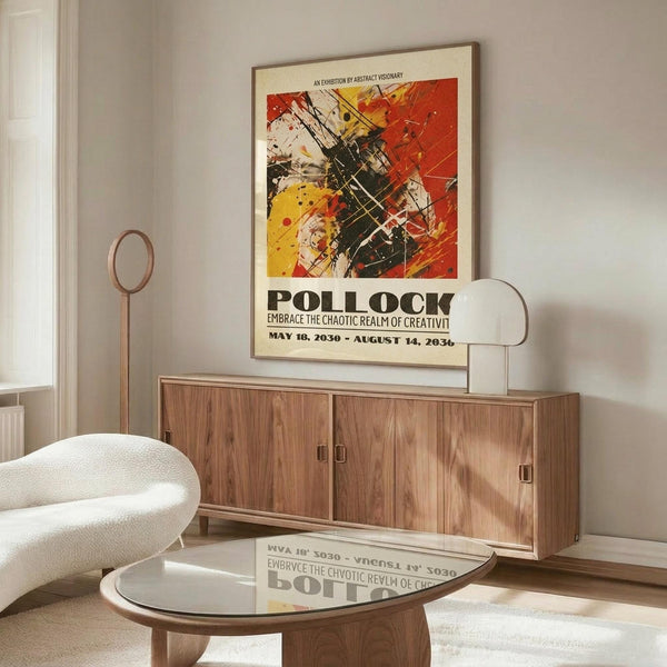 May include: Abstract art poster with vibrant red, yellow, and black paint splatters and gestural brushstrokes, displayed in thin brown frame above walnut credenza in modern living room with white upholstered chair, glass coffee table, and brass floor lamp