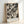 May include: Black and white abstract expressionist art print in light wood frame, leaning against white wall. Features dynamic paint splatters, drips, and gestural marks across cream background. Text at bottom reads "POLLOCK" and "Expressive Expressionist Movement" in clean typography.