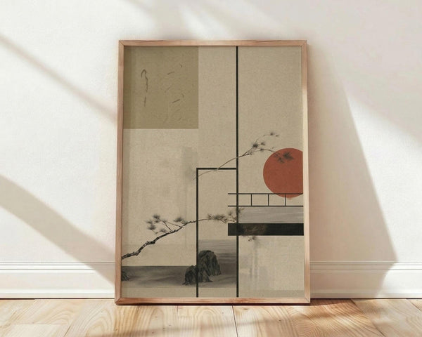 May include: Framed Japanese-inspired artwork leaning against white wall on light wooden floor. Print features minimalist composition with geometric rectangles in beige and sage green tones, red-orange sun, delicate pine branches with needles, and mountain silhouettes. Natural wood frame with warm honey finish. Soft diagonal shadows cast across white textured wall from natural lighting.
