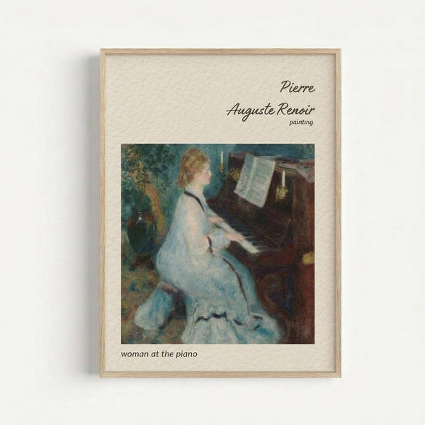 A framed art print featuring Renoir's impressionist painting of a woman in a flowing white dress playing piano, with sheet music visible on the instrument. The artwork displays soft brushstrokes in blues, whites, and warm tones. The print has a cream-colored mat and light wood frame, displayed against a white wall.