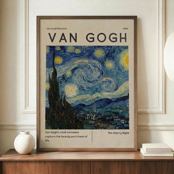 May include: Framed museum-style poster featuring Van Gogh's Starry Night painting with swirling blue sky, yellow stars, and dark cypress tree. The beige poster has "VAN GOGH" text at top and "1889" date. Display shows wooden frame on mid-century credenza with white ceramic vase and stacked books, against cream walls with white trim molding.