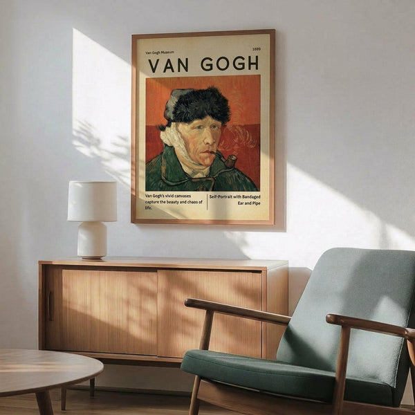 May include: Van Gogh self-portrait poster with bandaged ear and pipe, displayed above mid-century modern wooden credenza with table lamp. Sage green upholstered armchair with wooden frame sits nearby on wooden floor. Warm sunlight creates shadows across white wall in contemporary living room setting.
