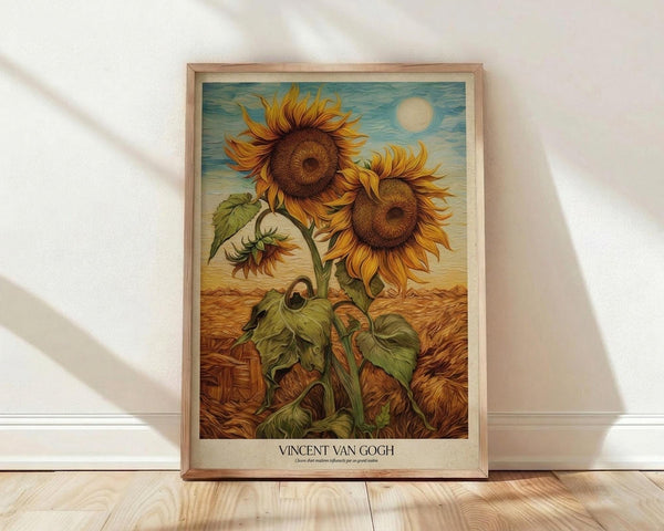 May include: Framed sunflower artwork in warm golden and brown tones leaning against white wall on light wood floor. The botanical illustration shows tall sunflowers with detailed petals and leaves against blue sky with sun. Natural wood frame surrounds the vintage-style print with artist attribution at bottom.