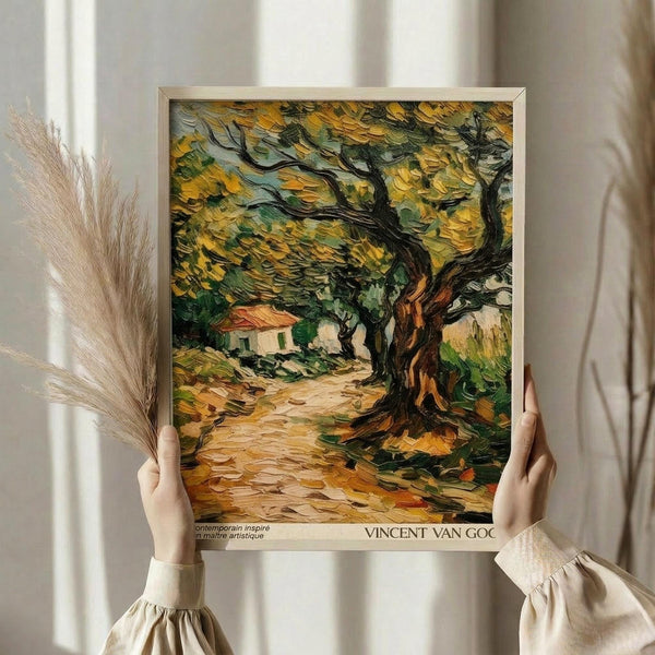 May include: Person holding framed Van Gogh-style painting featuring gnarled olive tree with thick brushstrokes in yellows and greens, small cottage visible in background, displayed against neutral curtained window with dried pampas grass stems alongside